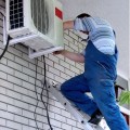 picture-of-technician-working-on-the-installation-of-the-outside-portion-of-the-airconditioning-unit_orig
